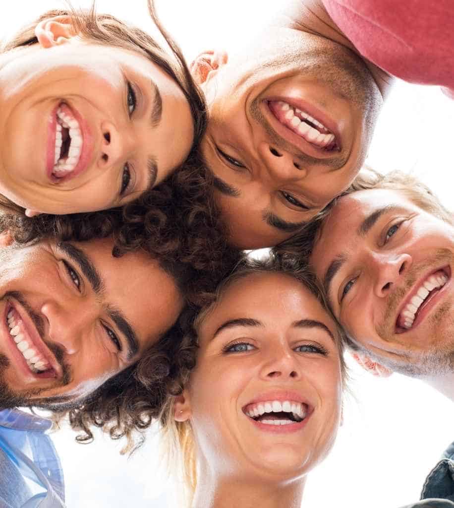 Smiling person showcasing white teeth after laser whitening treatment Reigate